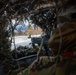 11th Airborne Division Soldier lines up his sight during JPMRC-AK 23-02