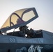 USS Makin Island flight deck operations during sunset