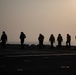 USS Makin Island flight deck operations during sunset