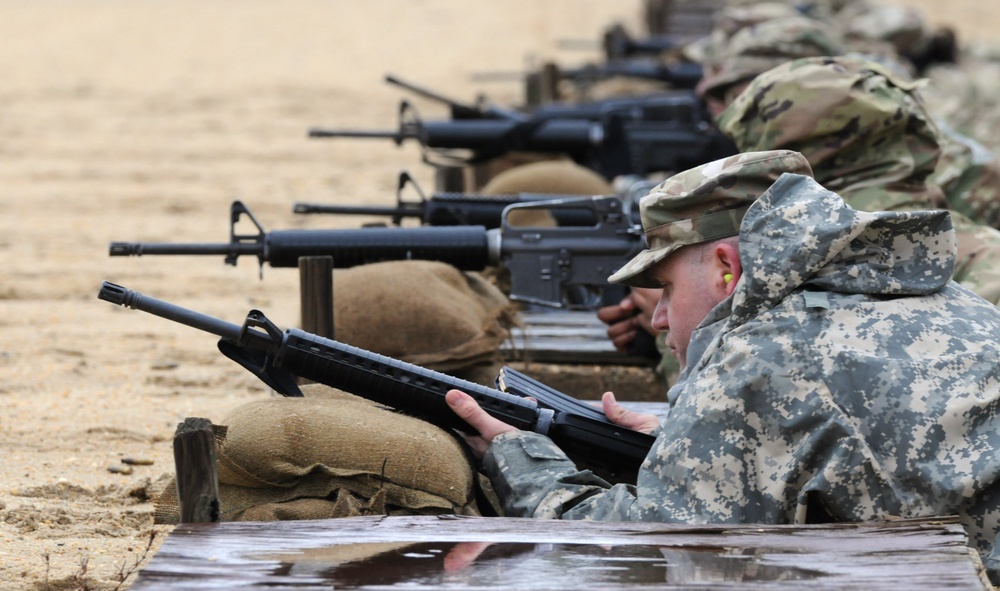 A Soldier from 2 Bn., 228 AVN, A Co. loads his weapon on zero range 26B, 1 APRIL 2023.