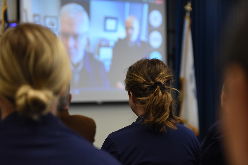 Coast Guard service member meritoriously promoted for devotion to duty and social work benefiting children in need