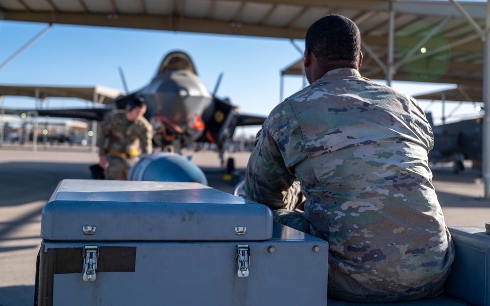 61st AMU loads HCC signed training bombs