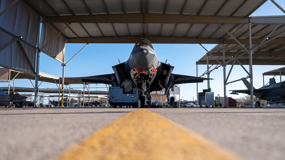 61st AMU loads HCC signed training bombs