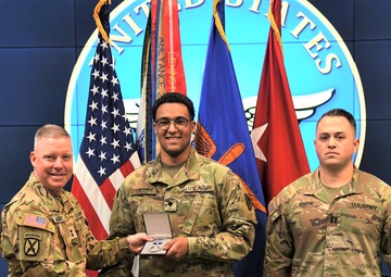Fort Rucker Soldier receives Army Recruiting Ribbon, promotion