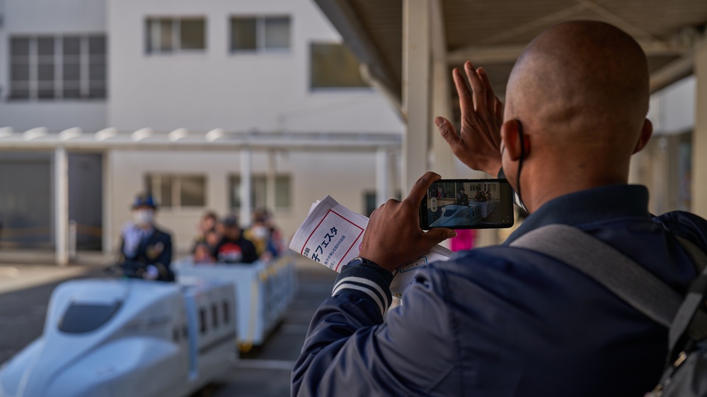 Japanese locals and Status of Forces Agreement members partake in festivities
