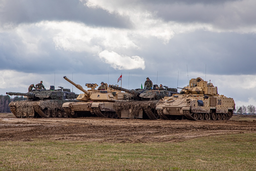 German Leopards and 1-9 CAV Apache Co. Abrams Tanks Charge the Field in Poland