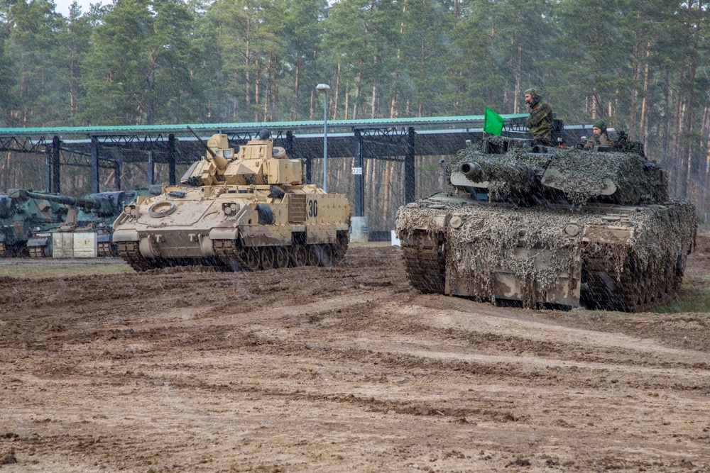 German Leopards and 1-9 CAV Apache Co. Abrams Tanks Charge the Field in Poland