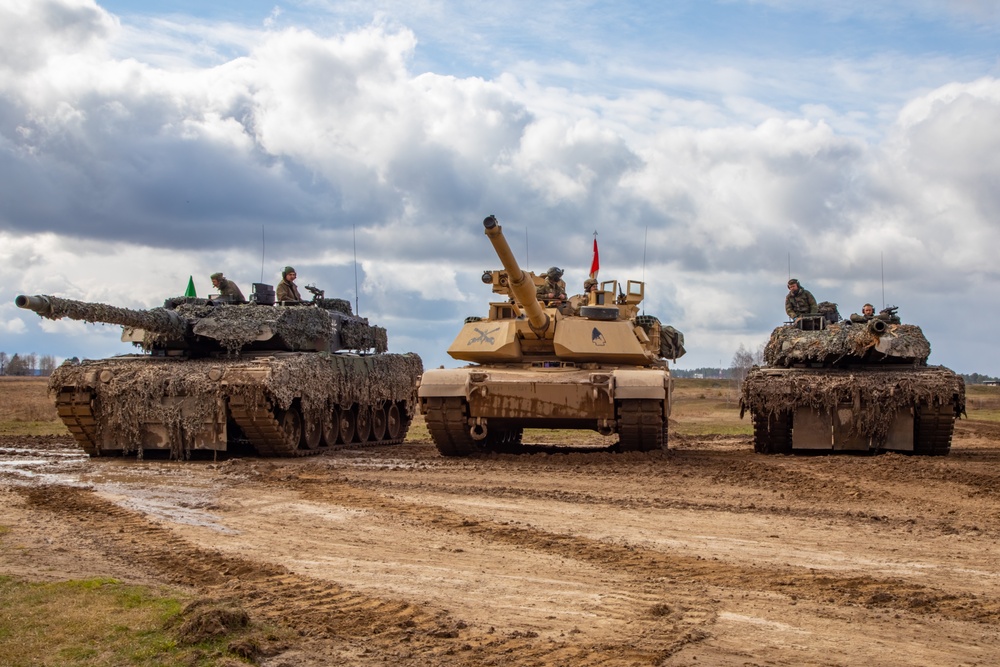 German Leopards and 1-9 CAV Apache Co. Abrams Tanks Charge the Field in Poland