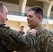 Soldiers from the Polish Territorial Defense Force present Bronze Polish Army Medals to ILARNG Soldiers