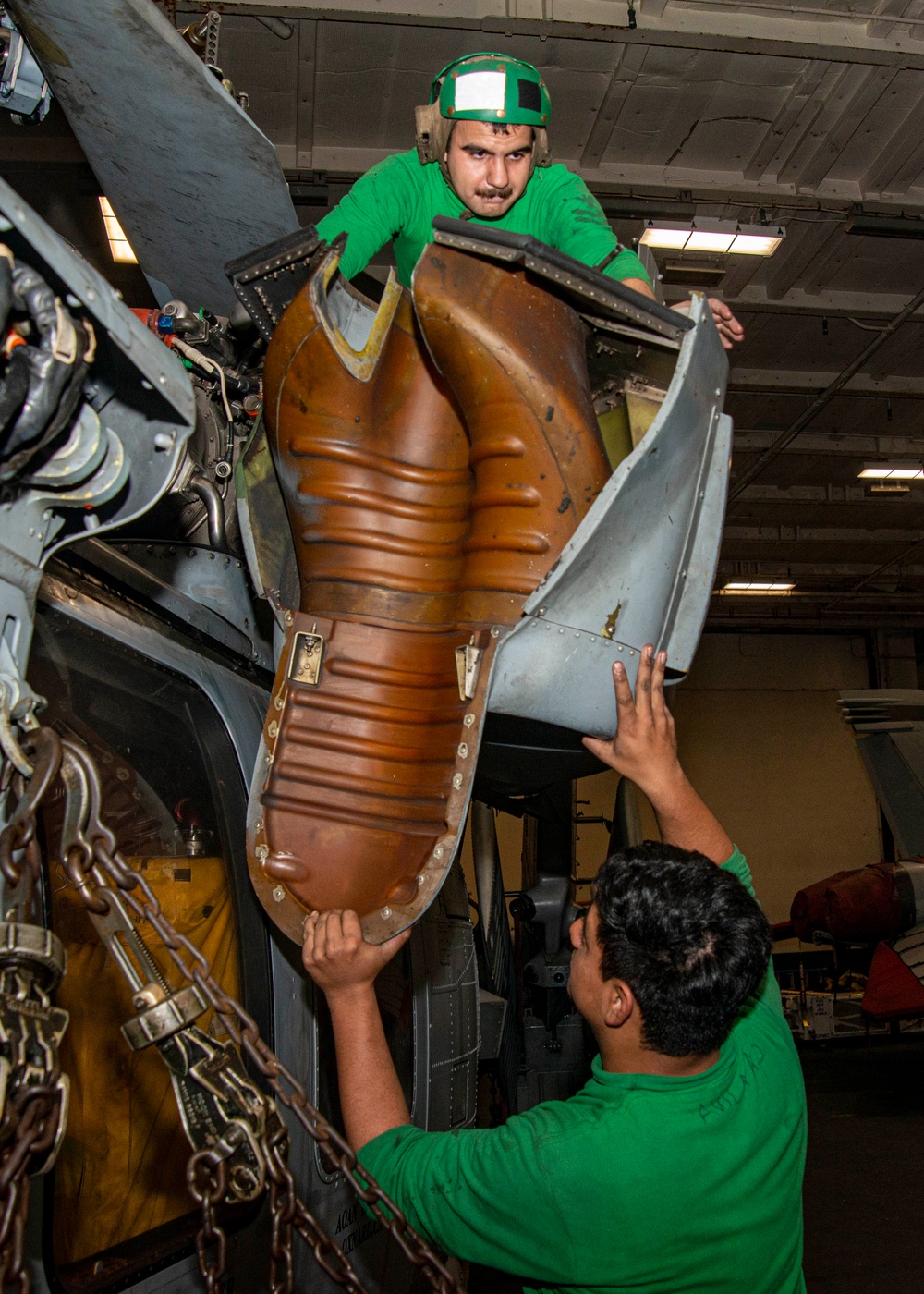 Sailors Lift Helicopter Component