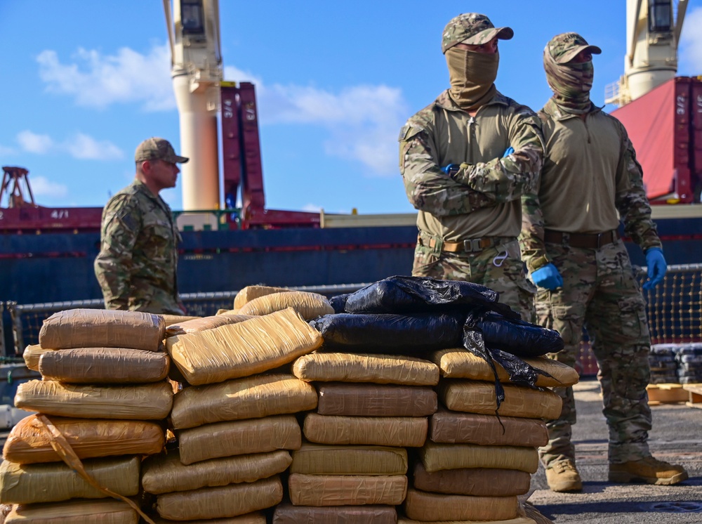 Members of U.S. Coast Guard Law Enforcement Detachment 406 offload interdicted narcotics aboard USS Farragut (DDG 99) in Port Everglades, Florida, April 4, 2023. The offloaded drugs were seized from four go-fast smuggling interdictions by crew members of Coast Guard LEDET 406, Navy Combat Element (CEL) and Helicopter Maritime Strike Squadron Six Zero (HSM-60) in the Eastern Pacific Ocean. (U.S. Coast Guard photo by Petty Officer 3rd Class Eric Rodriguez)