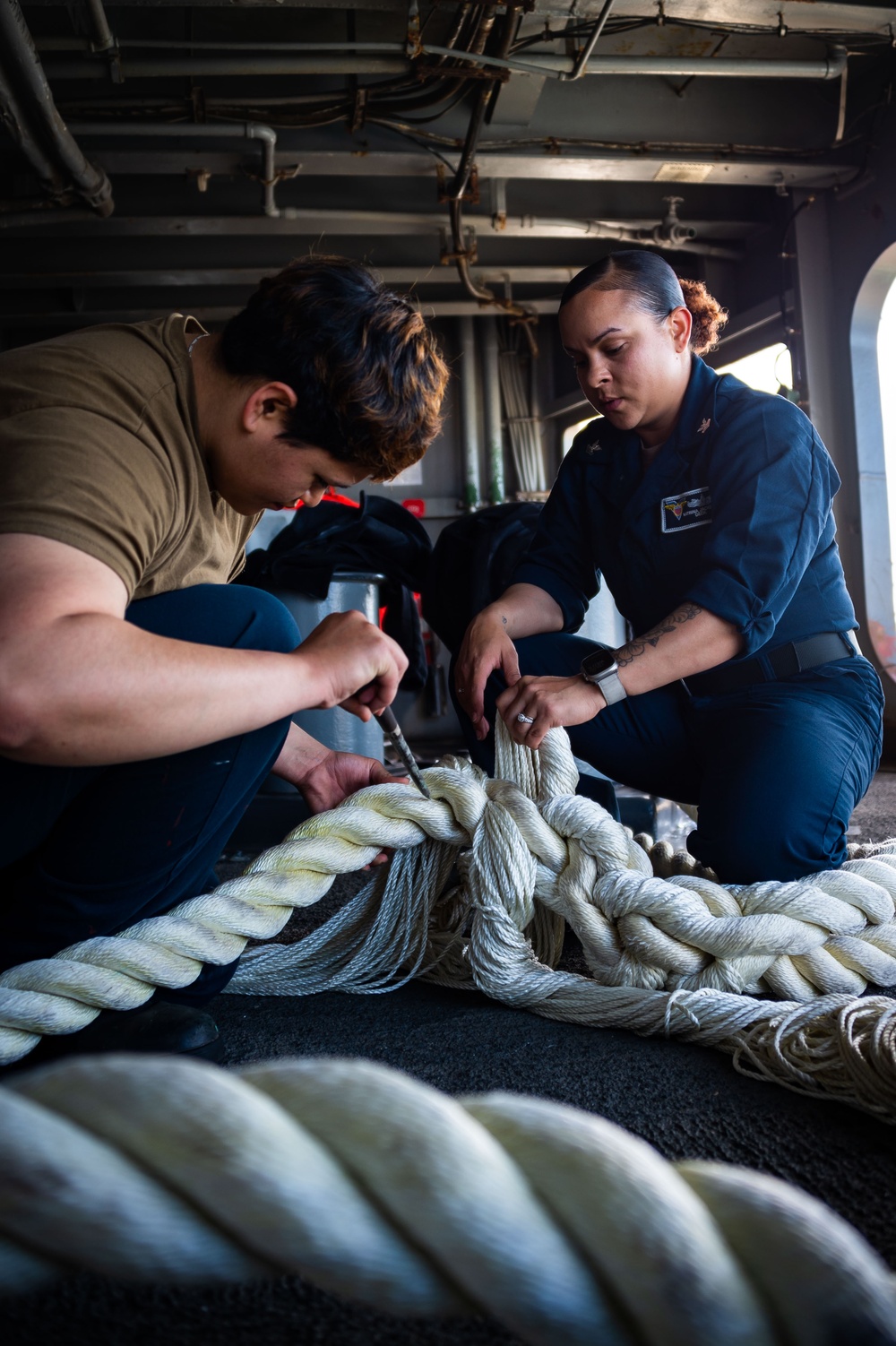 Sailors Work on the Fantail of USS Carl Vinson (CVN70)