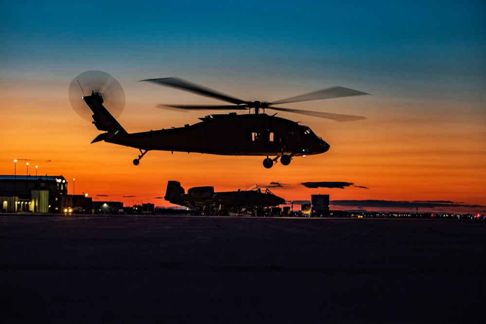 Black Hawks taking off into the sunset