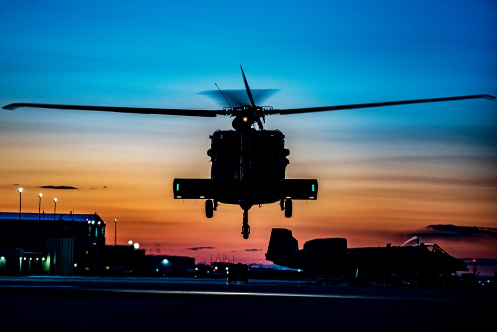 Black Hawks taking off into the sunset