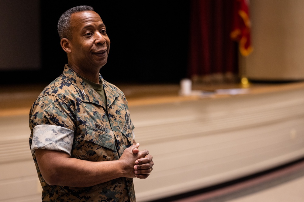 Col. Michael L. Brooks speaks to Navy-Marine Corps Relief Society representatives