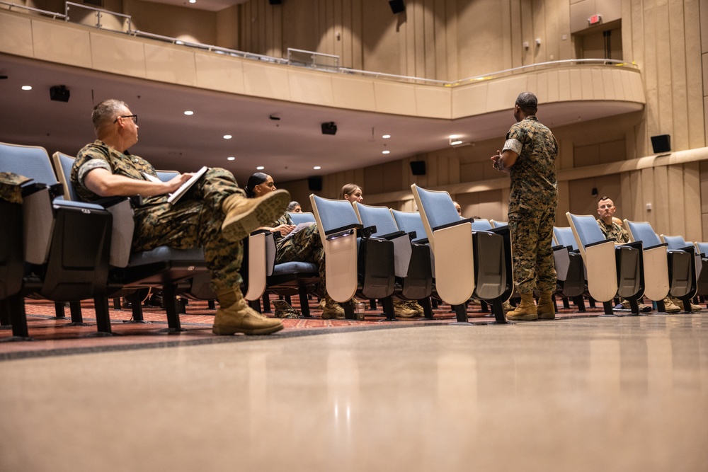 Col. Michael L. Brooks speaks to Navy-Marine Corps Relief Society representatives