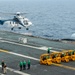 Helicopter Deposits Cargo On Flight Deck