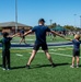Naval Special Warfare Operators Demonstrate Safety, Teamwork, Fitness to 100 Elementary Students