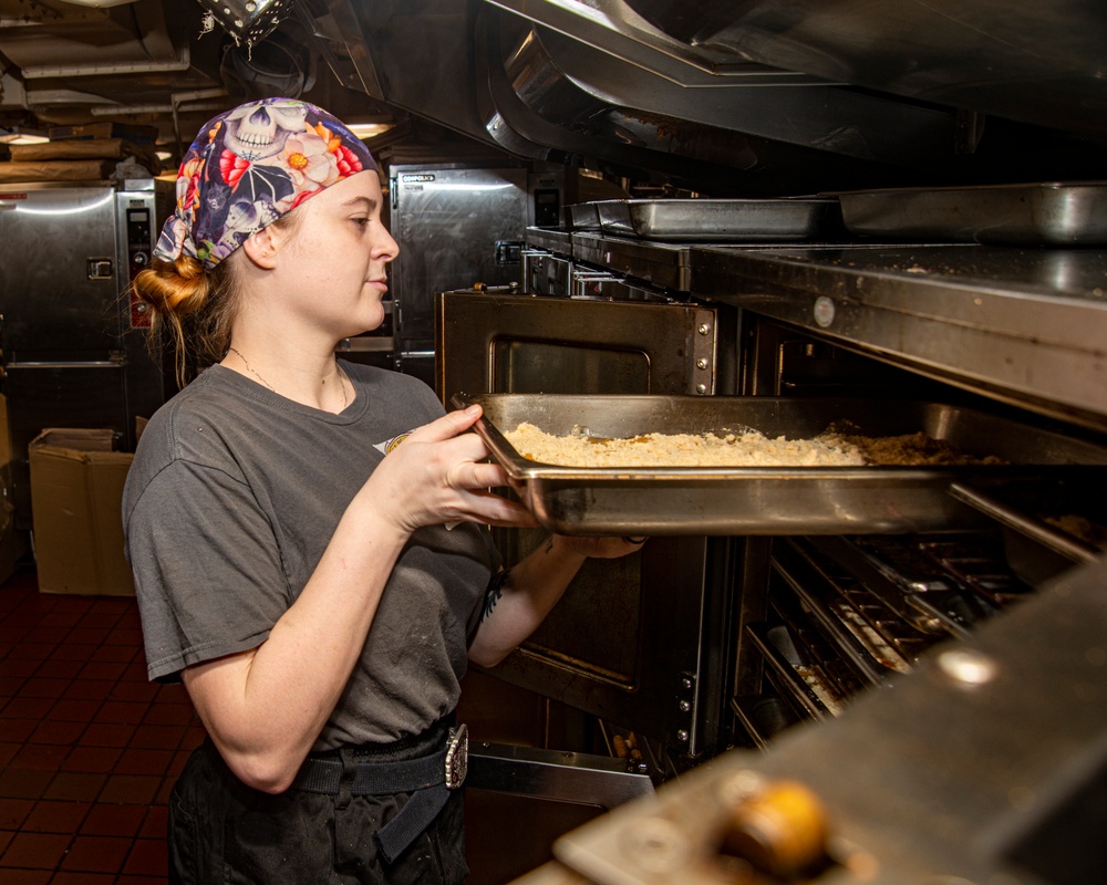 Sailor Places Dessert Into Oven