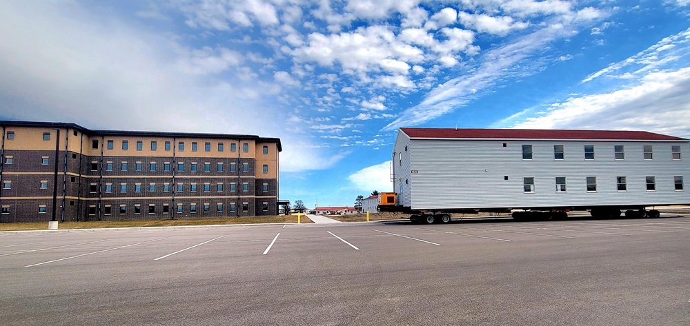 Contractors move third World War II-era barracks to new location