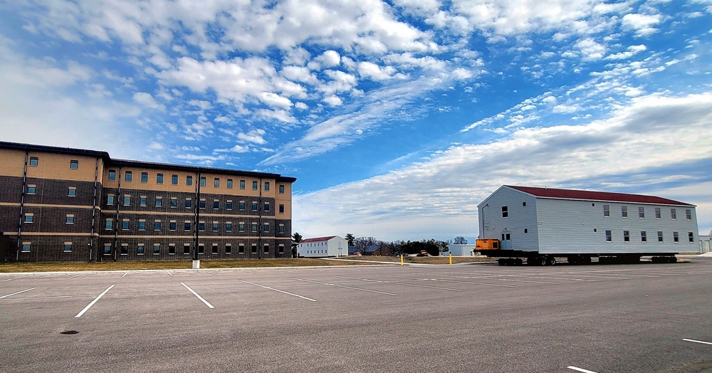 Contractors move third World War II-era barracks to new location