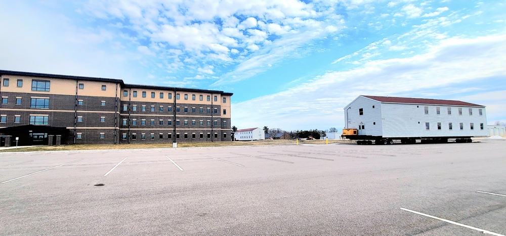 Contractors move third World War II-era barracks to new location