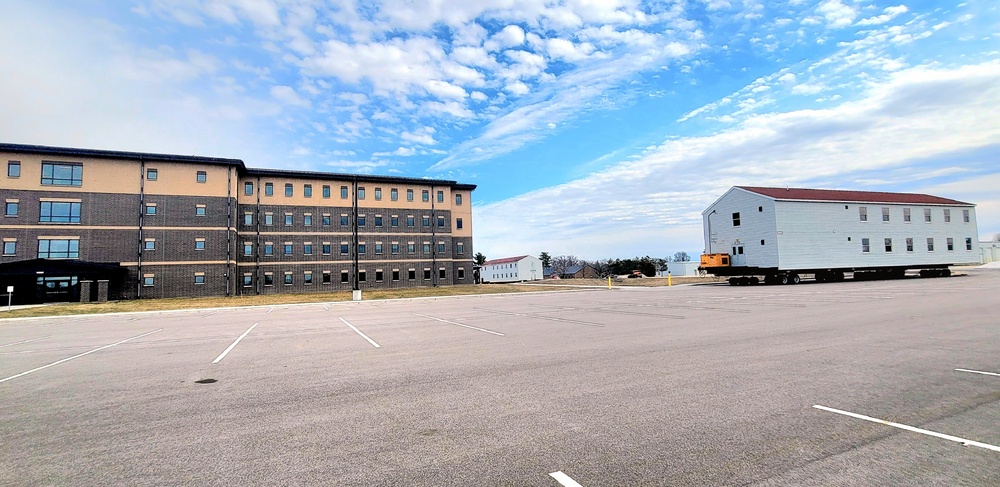 Contractors move third World War II-era barracks to new location