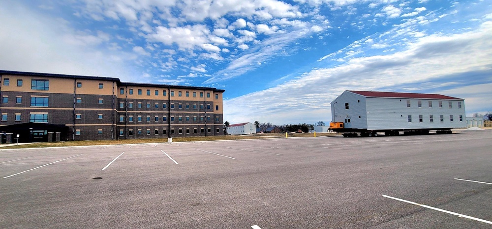 Contractors move third World War II-era barracks to new location