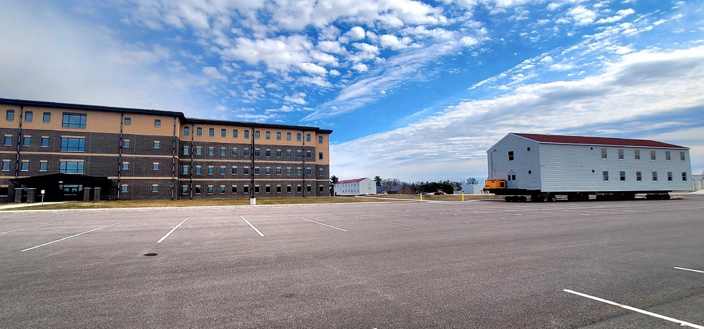 Contractors move third World War II-era barracks to new location