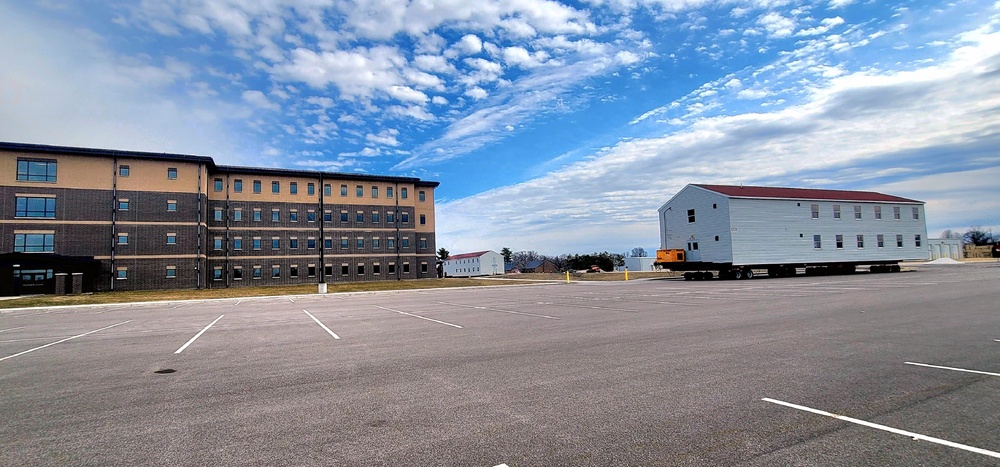 Contractors move third World War II-era barracks to new location