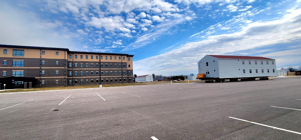 Contractors move third World War II-era barracks to new location