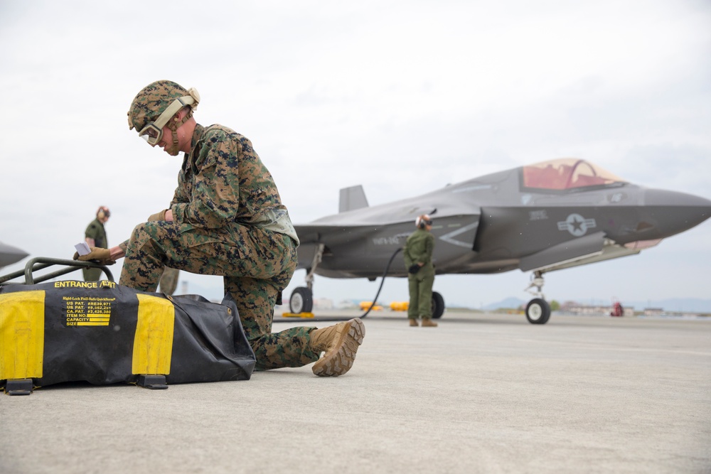 Marines with MAG-12 refuel armed F-35s