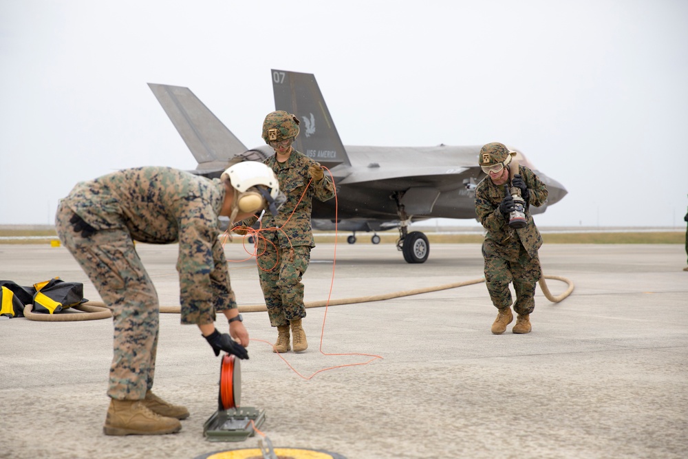 Marines with MAG-12 refuel armed F-35s