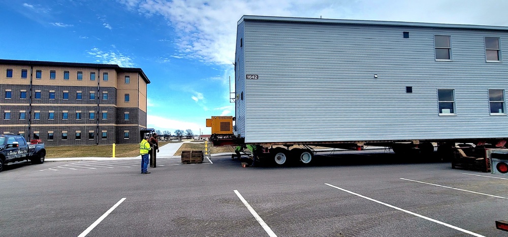 Contractors move third World War II-era barracks to new location