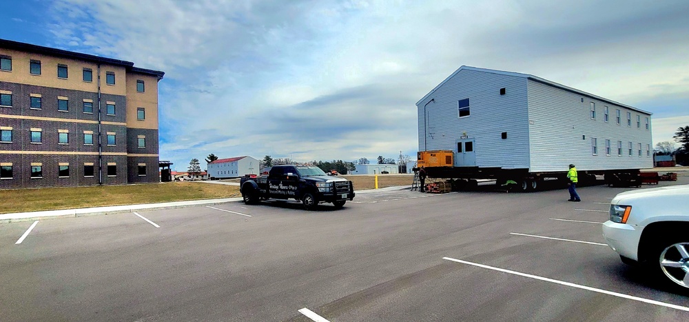 Contractors move third World War II-era barracks to new location