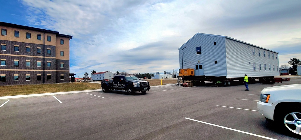 Contractors move third World War II-era barracks to new location