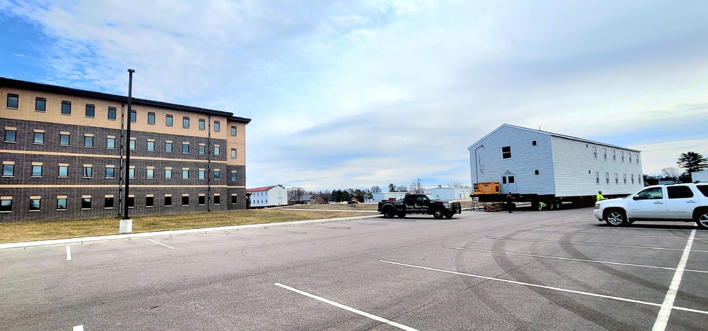 Contractors move third World War II-era barracks to new location