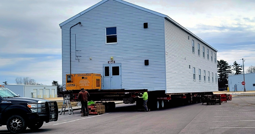 Contractors move third World War II-era barracks to new location