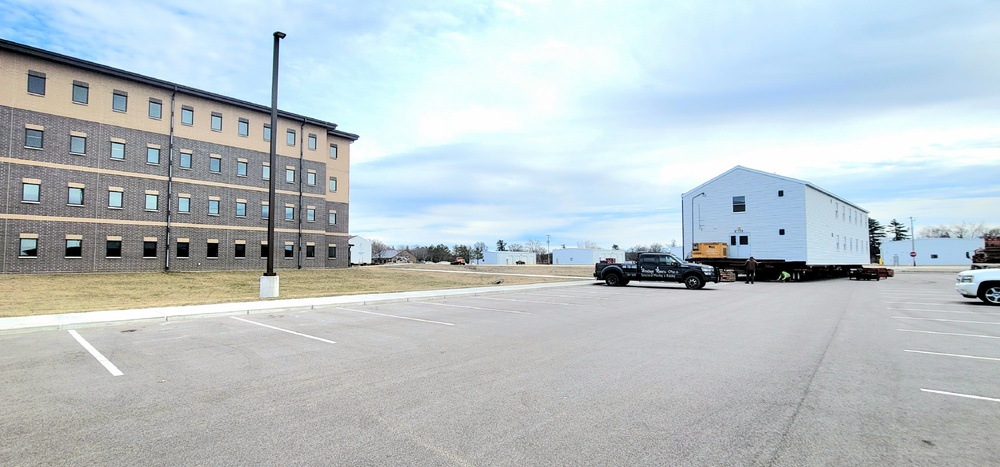 Contractors move third World War II-era barracks to new location