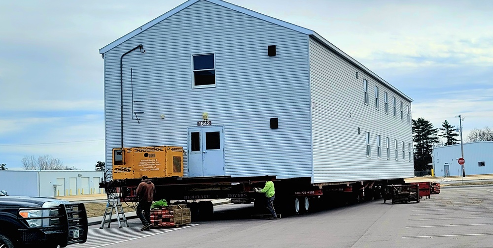 Contractors move third World War II-era barracks to new location