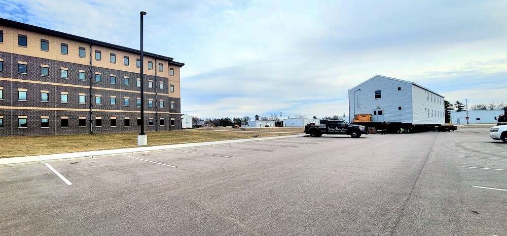 Contractors move third World War II-era barracks to new location