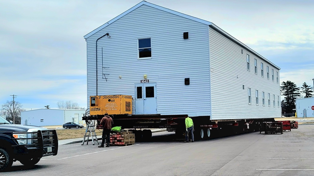 Contractors move third World War II-era barracks to new location