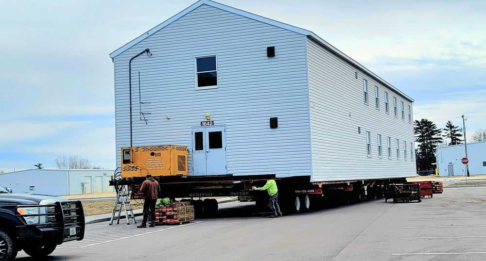 Contractors move third World War II-era barracks to new location