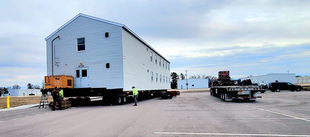 Contractors move third World War II-era barracks to new location