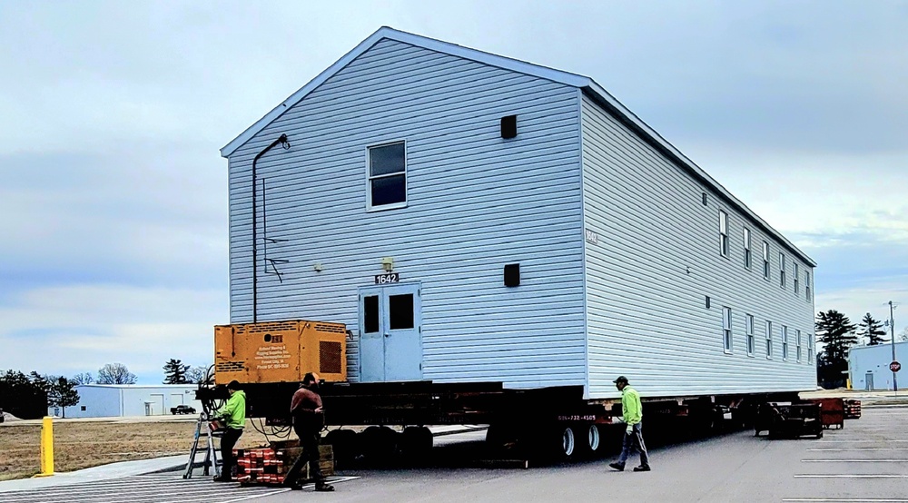 Contractors move third World War II-era barracks to new location