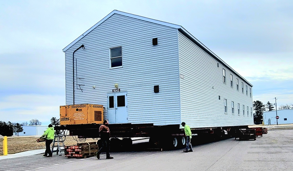 Contractors move third World War II-era barracks to new location