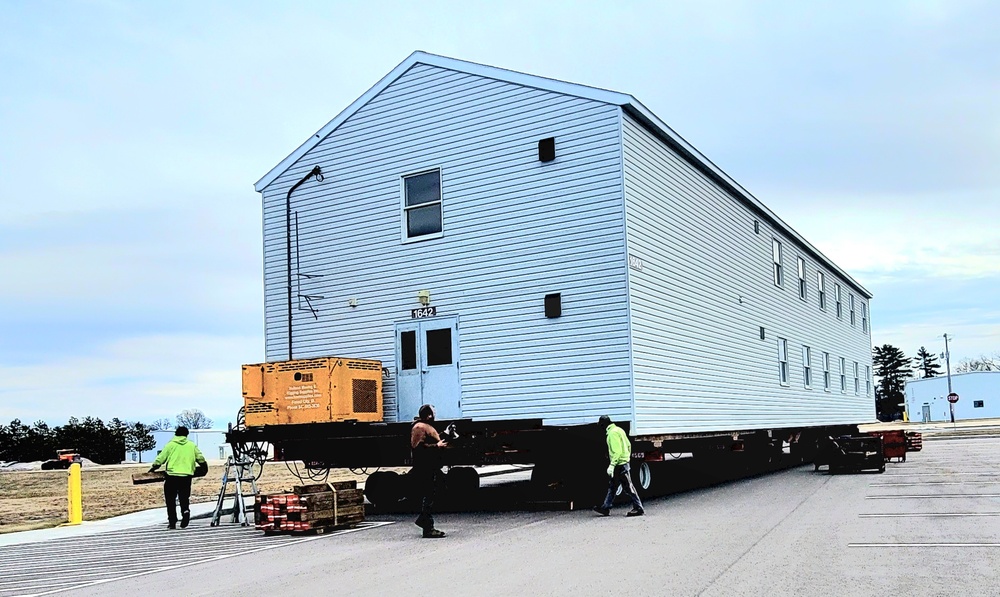 Contractors move third World War II-era barracks to new location