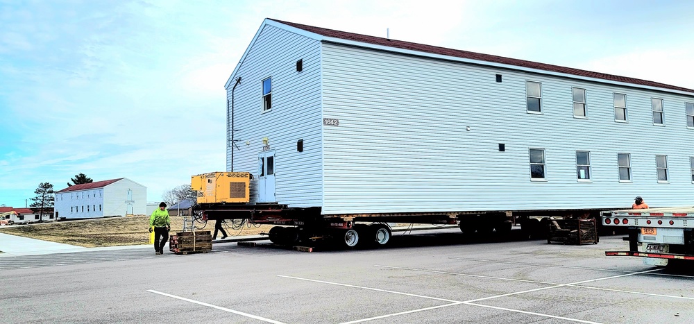 Contractors move third World War II-era barracks to new location