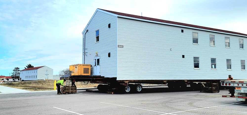 Contractors move third World War II-era barracks to new location