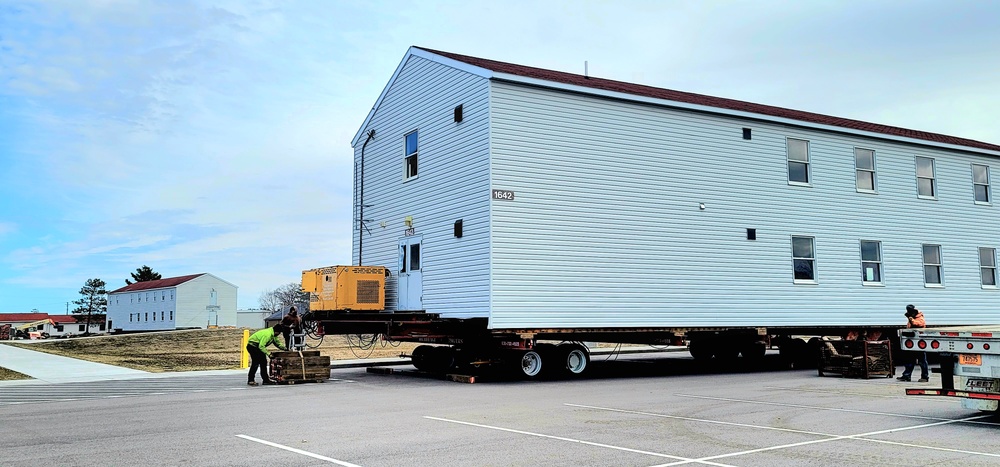 Contractors move third World War II-era barracks to new location